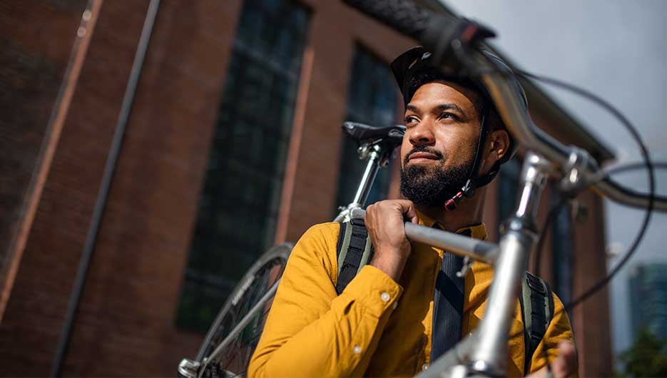 man holding bike