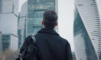 Man looking at building